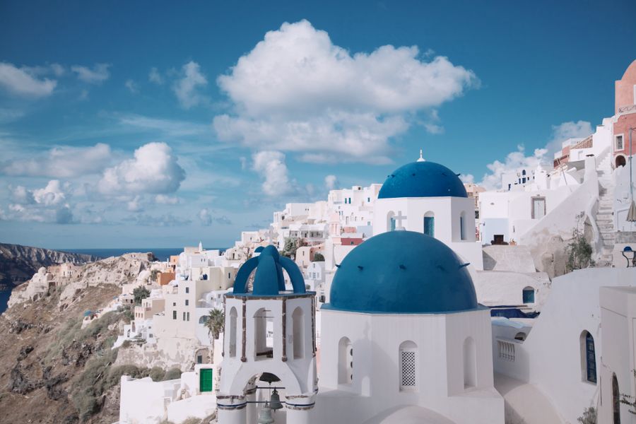 photo of santorini greece — The viewpoint at golden hour: livestream the sunset to everyone back home.