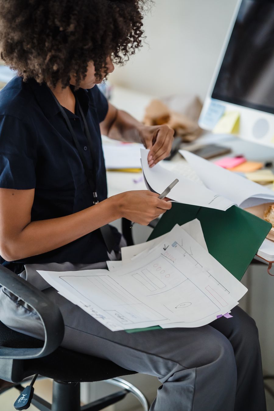 woman working with documents in office — eSIM Troubleshooter: the fastest way to turn a vague travel question into a next step.