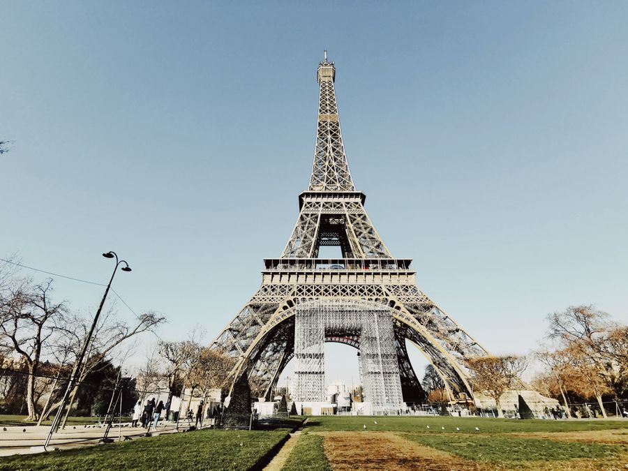low angle shot of the eiffel tower against blue sky — Multi-Country eSIM Guide: answers first, never a signup wall.