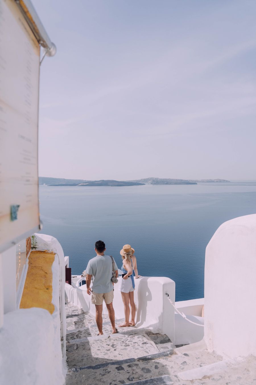 couple walking down the stairs in santorini greece — APN Settings Lookup: answers first, never a signup wall.