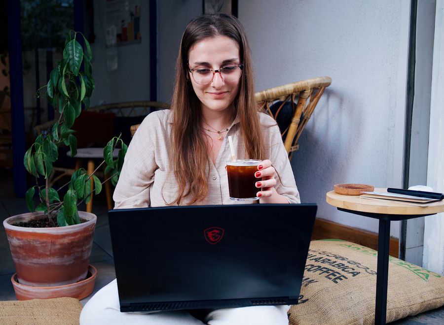 a woman sitting with a laptop — Rerun-friendly by design — the tool expects you to compare options.
