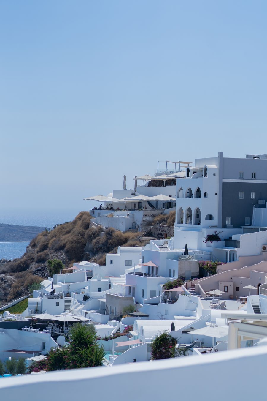 the view from the top of a hill overlooking the ocean