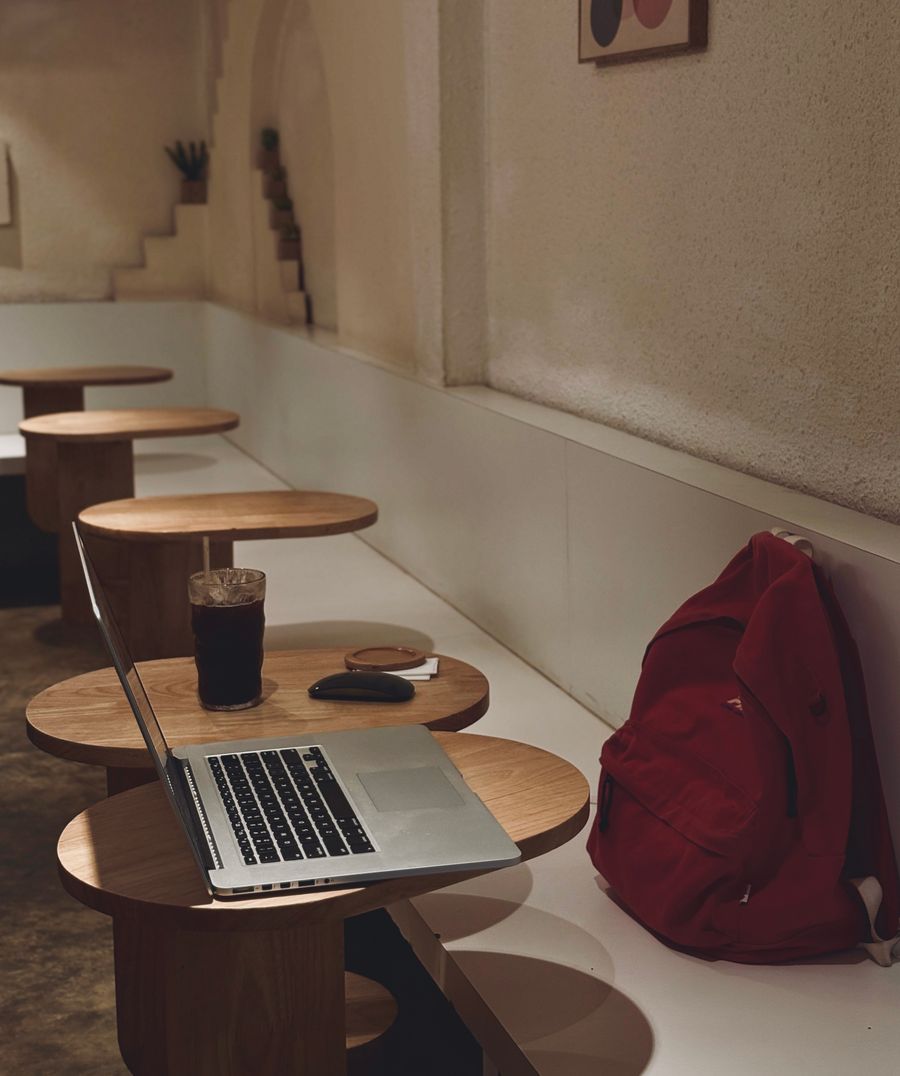 cozy cafe workspace with laptop and drink — From question to next step: Connection Quality Grader shortens the path to a decision.