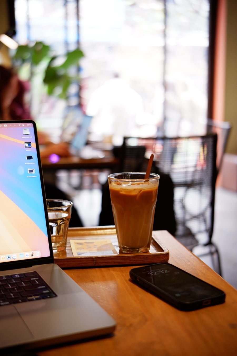iced coffee on wooden table in modern cafe