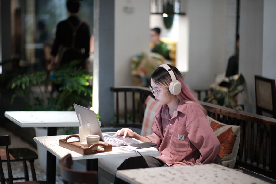 young woman studying in vietnamese cafe — No account, no install, no waiting — Find My Plan loads and answers.