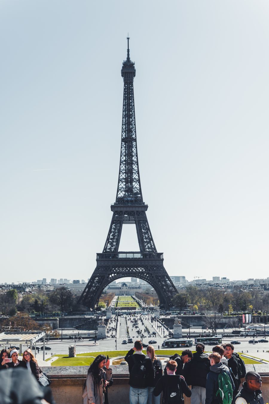 tourists at the eiffel tower in paris daytime view — From Resend eSIM QR Code's answer to checkout is a short, well-lit path.