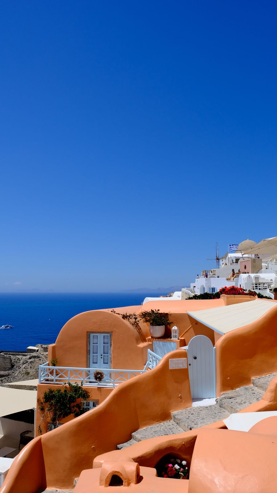 picturesque view of santorini s iconic architecture — A forma de onda da voz significa que está ouvindo — fale naturalmente.