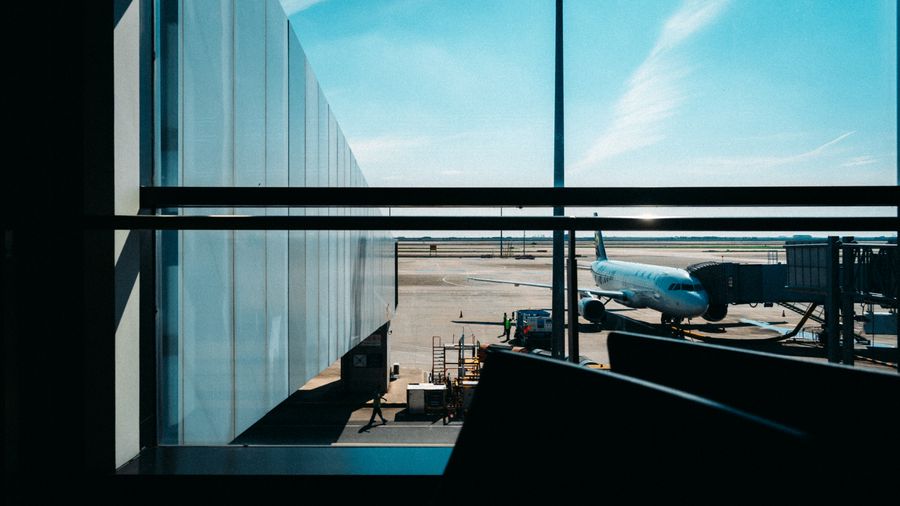 bright airport terminal with docked airplane view — The capability matrix lists everything Captive Portal Detector does — no asterisks.