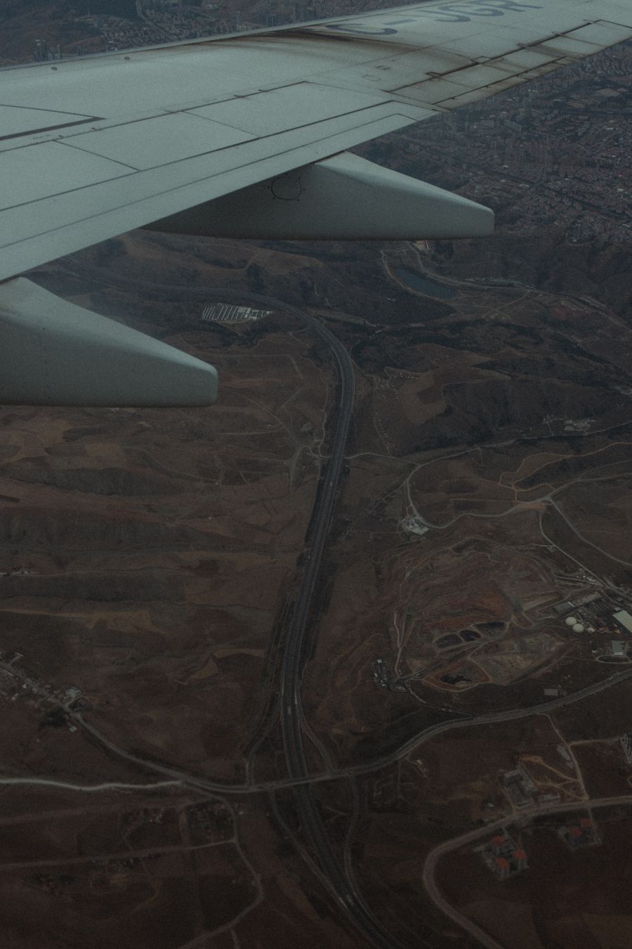 aerial view from airplane over barren landscape