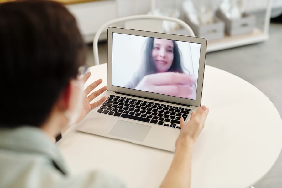woman having a video call — Device Compatibility Checker: the fastest way to turn a vague travel question into a next step.