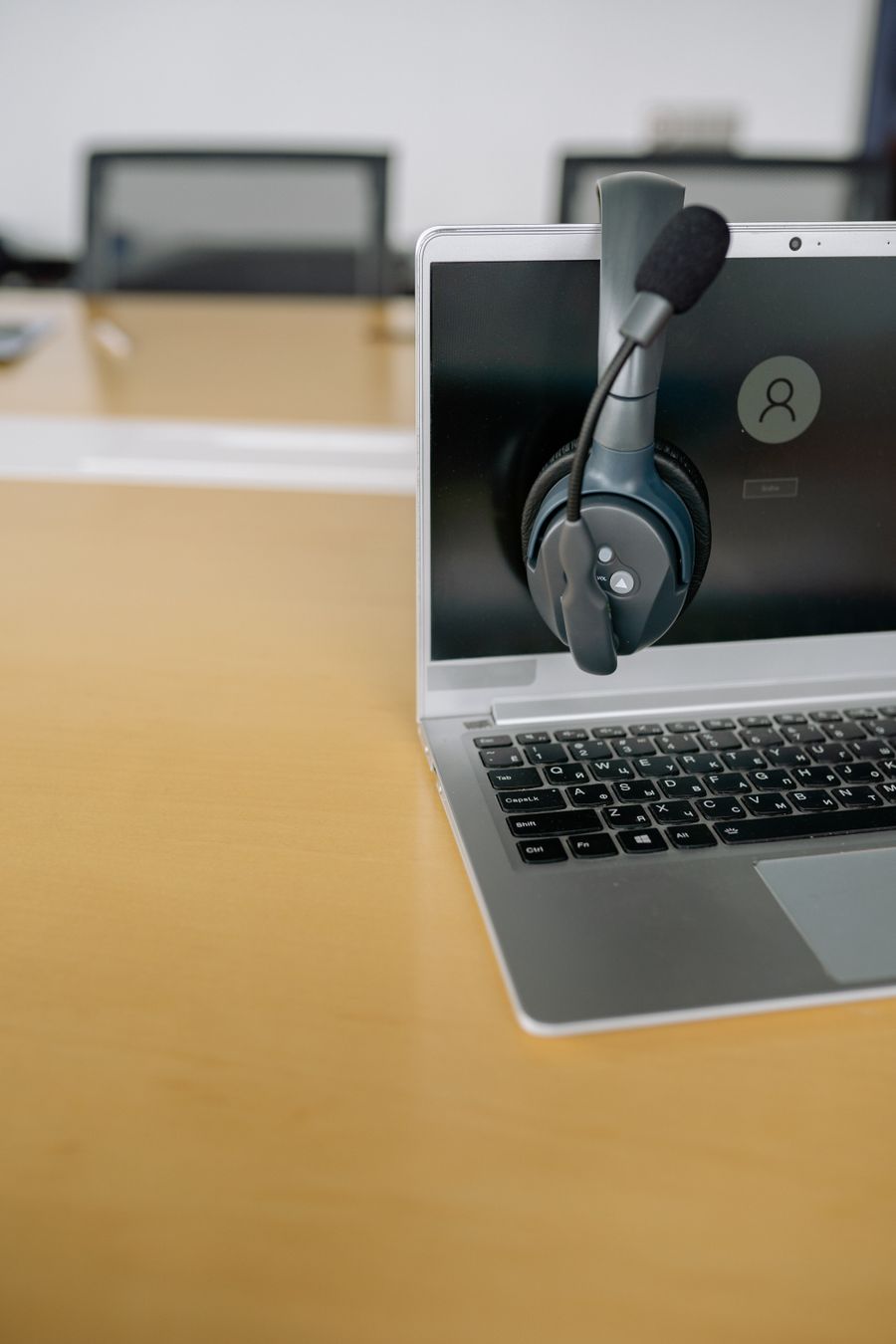 close up shot of a headset on a laptop — No account, no install, no waiting — Best Network by City loads and answers.